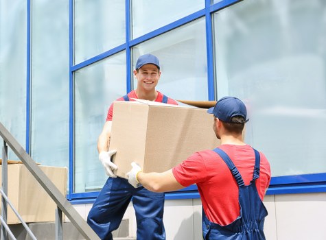 Removal professionals protecting furniture during a Kensalgreen flat move