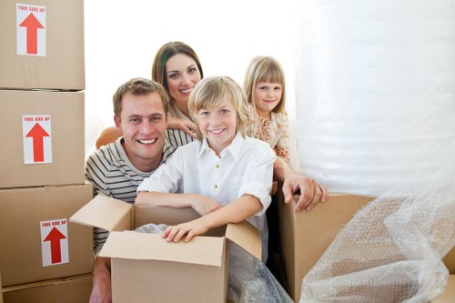Professional movers handling furniture in Kensalgreen